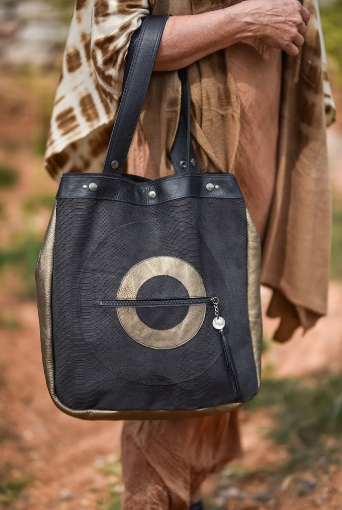 Large black and gold handmade leather tote bag with circle design