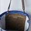 Large metallic blue handmade leather tote bag with star design and front pocket