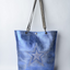 Large metallic blue handmade leather tote bag with star design and front pocket