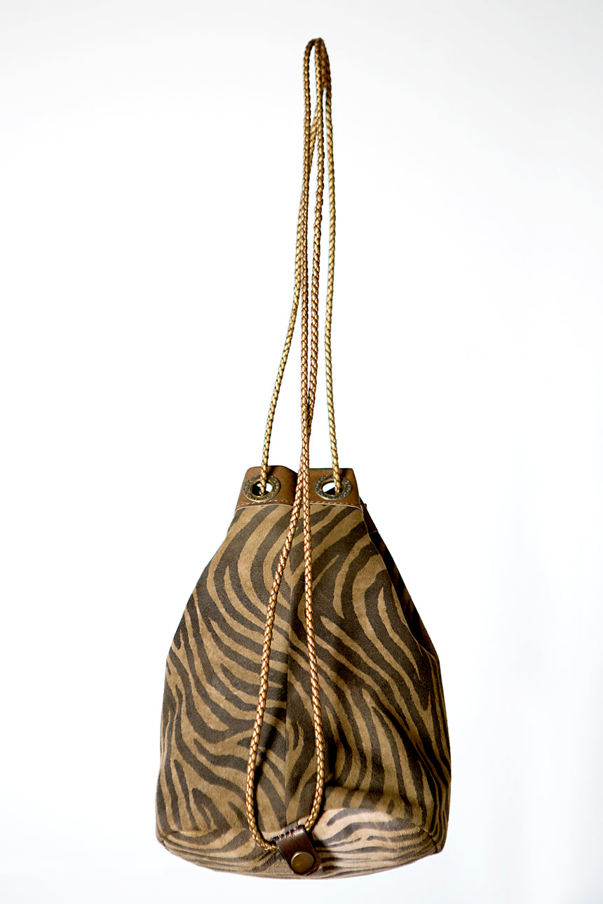Brown handmade leather bag and backpack with zebra print detail